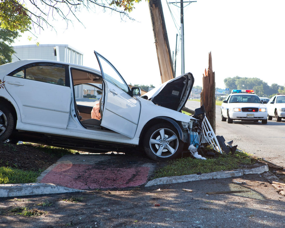Car Crashes Telephone Pole