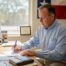 Texas insurance agent working at cluttered desk