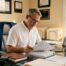 Contractor reviewing surety bond paperwork in Texas office