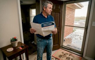 Homeowner examines insurance after storm damage in Lubbock Texas