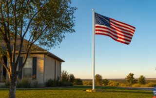 American flag waving on a tall flagpole over a Lubbock Texas front yard at sunset for the 250th Fourth of July, Independence Day
