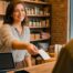 General liability insurance Texas 2026 — Lubbock Texas small business owner behind the counter of her independent shop.