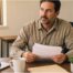 Texas surety bond contractor guide 2026 — Lubbock contractor reviewing bond documents at his desk.