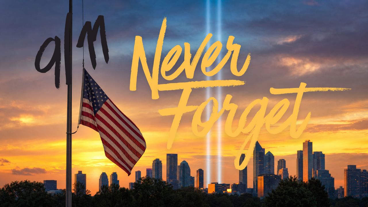 American flag at half-staff beside two vertical Tribute in Light beams rising over NY city skyline at golden sunset. Never Forget — 9/11 25th Anniversary Tribute